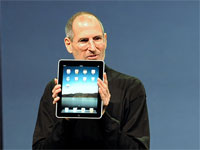 Steve Jobs holding an iPad