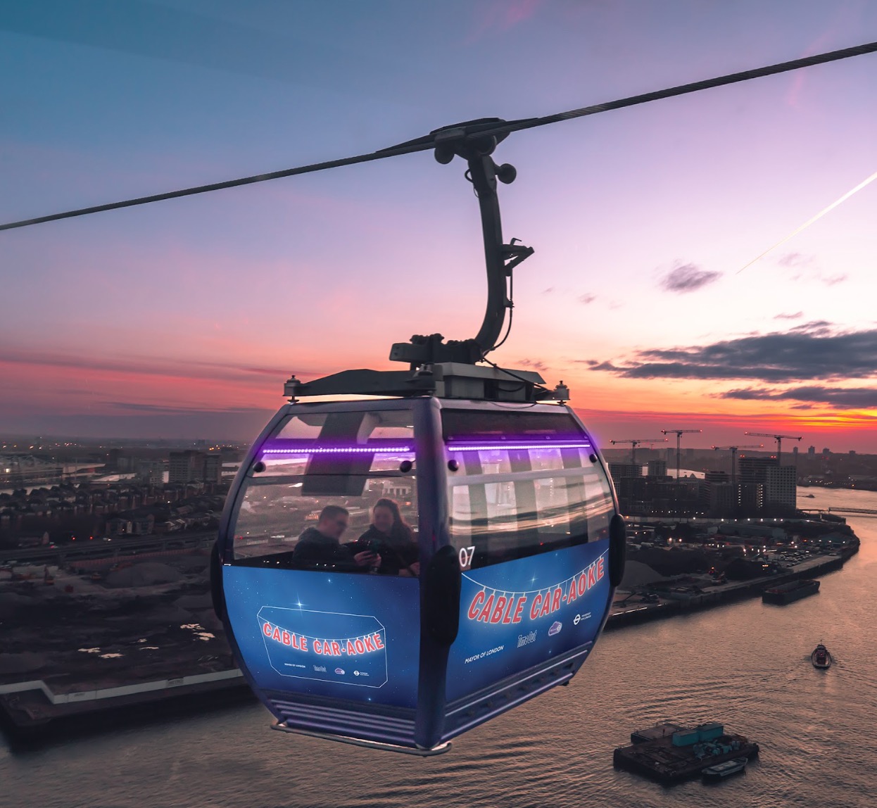 Cable Car-aoke branded gondola against a cloudy London sky